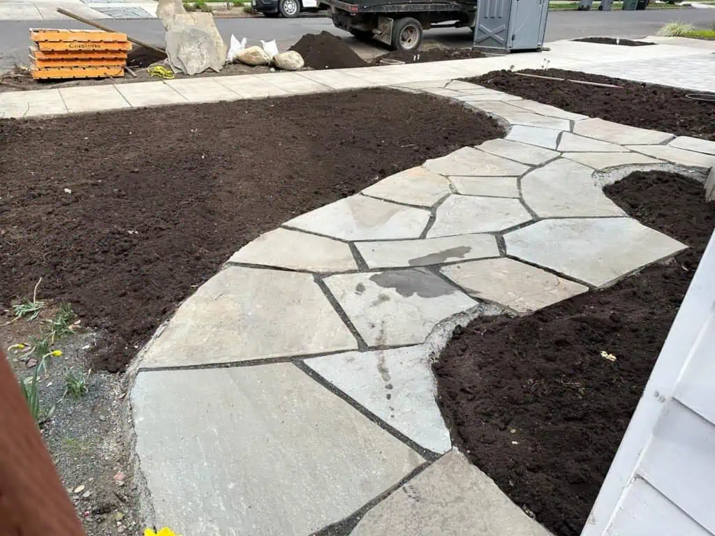 High-quality stone paving for garden paths.